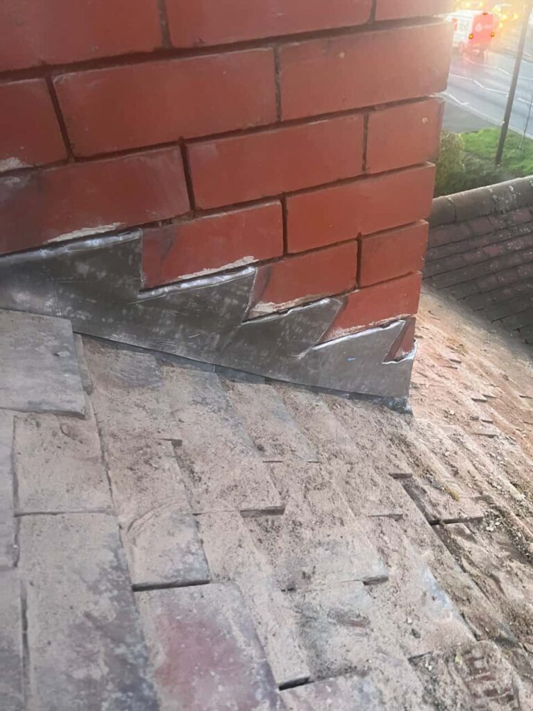 This is a photo of new leadwork being installed around an old chimney. Works carried out by LJ Roofing Pewsham